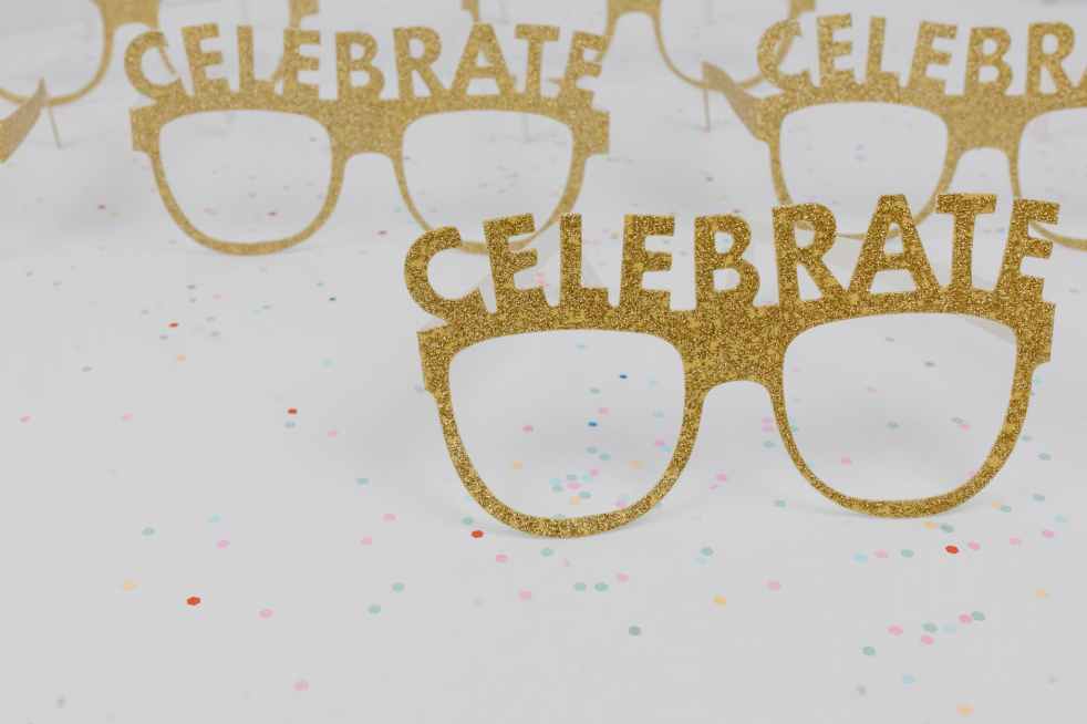 a poster with gold eyeglasses for party decor